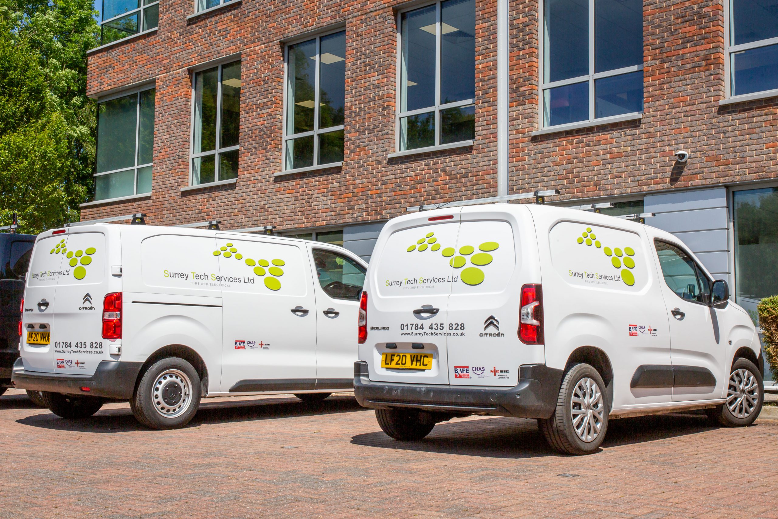 Surrey Tech Services vans parked outside office