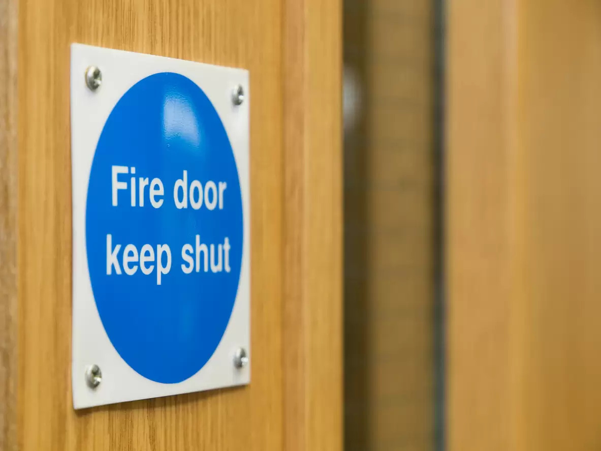 Why are fire doors self closing?